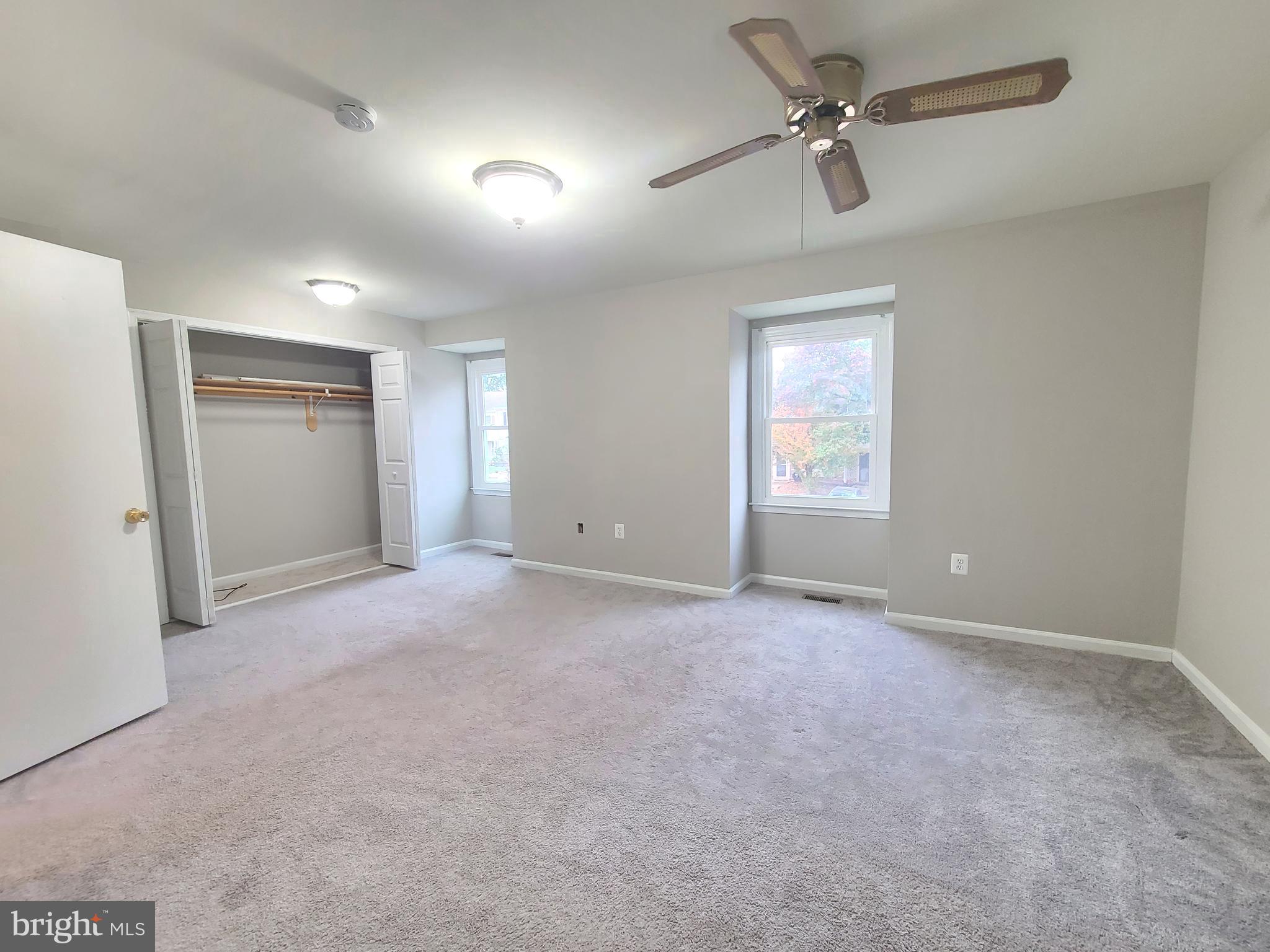 9050 Reynolds Place Manassas, VA 20110 - Photo 20 of 26 an empty room with windows and fan