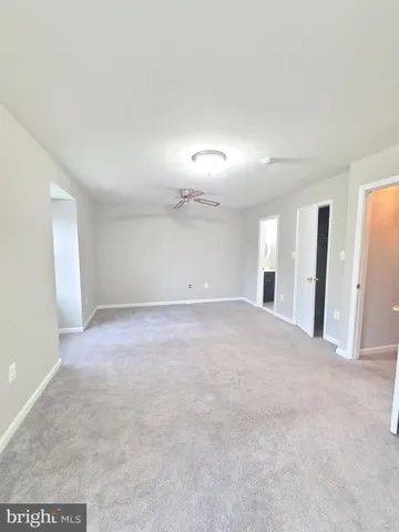 a bathroom with a toilet sink and shower