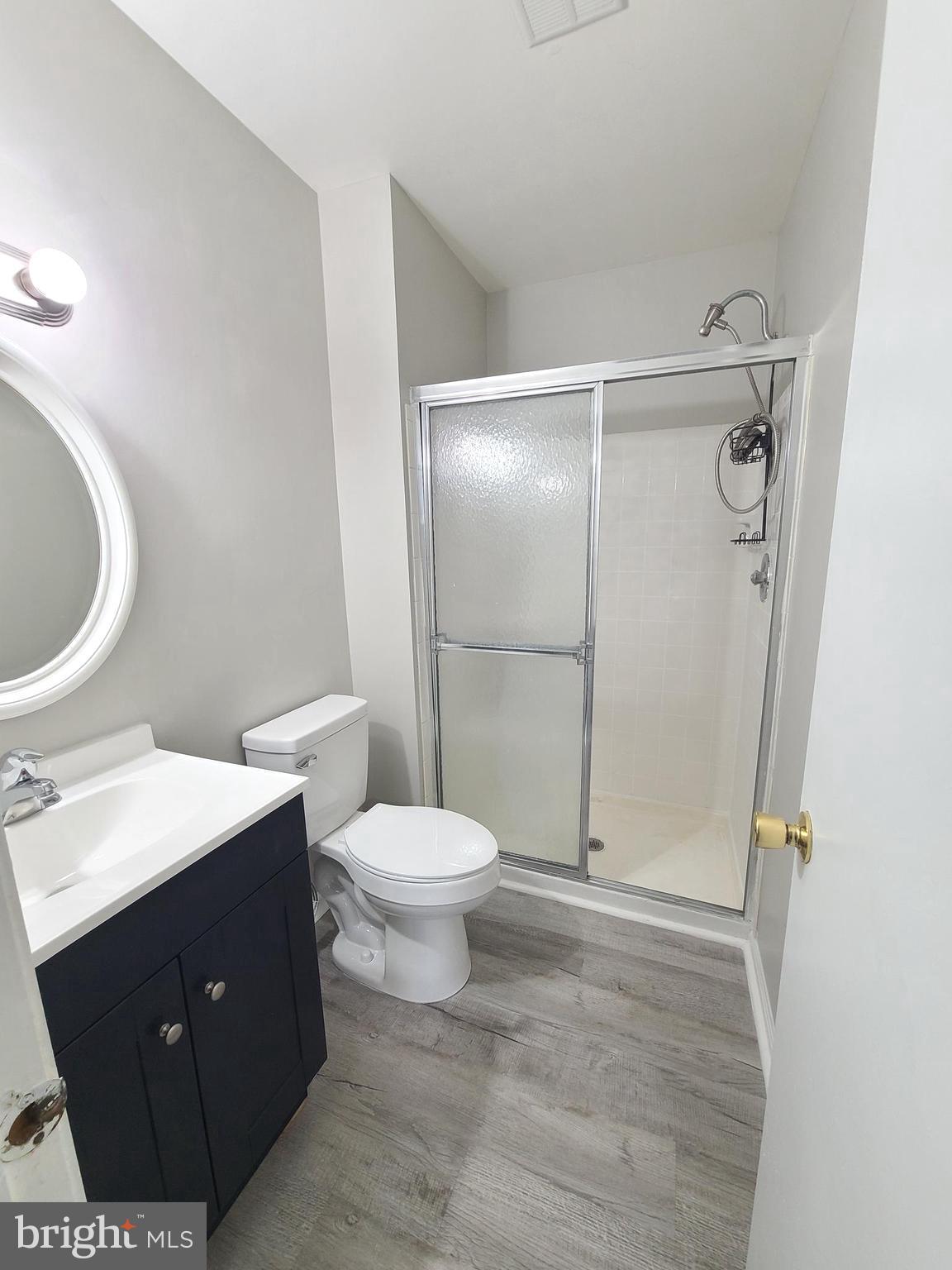 9050 Reynolds Place Manassas, VA 20110 - Photo 22 of 26 a bathroom with a toilet sink and shower