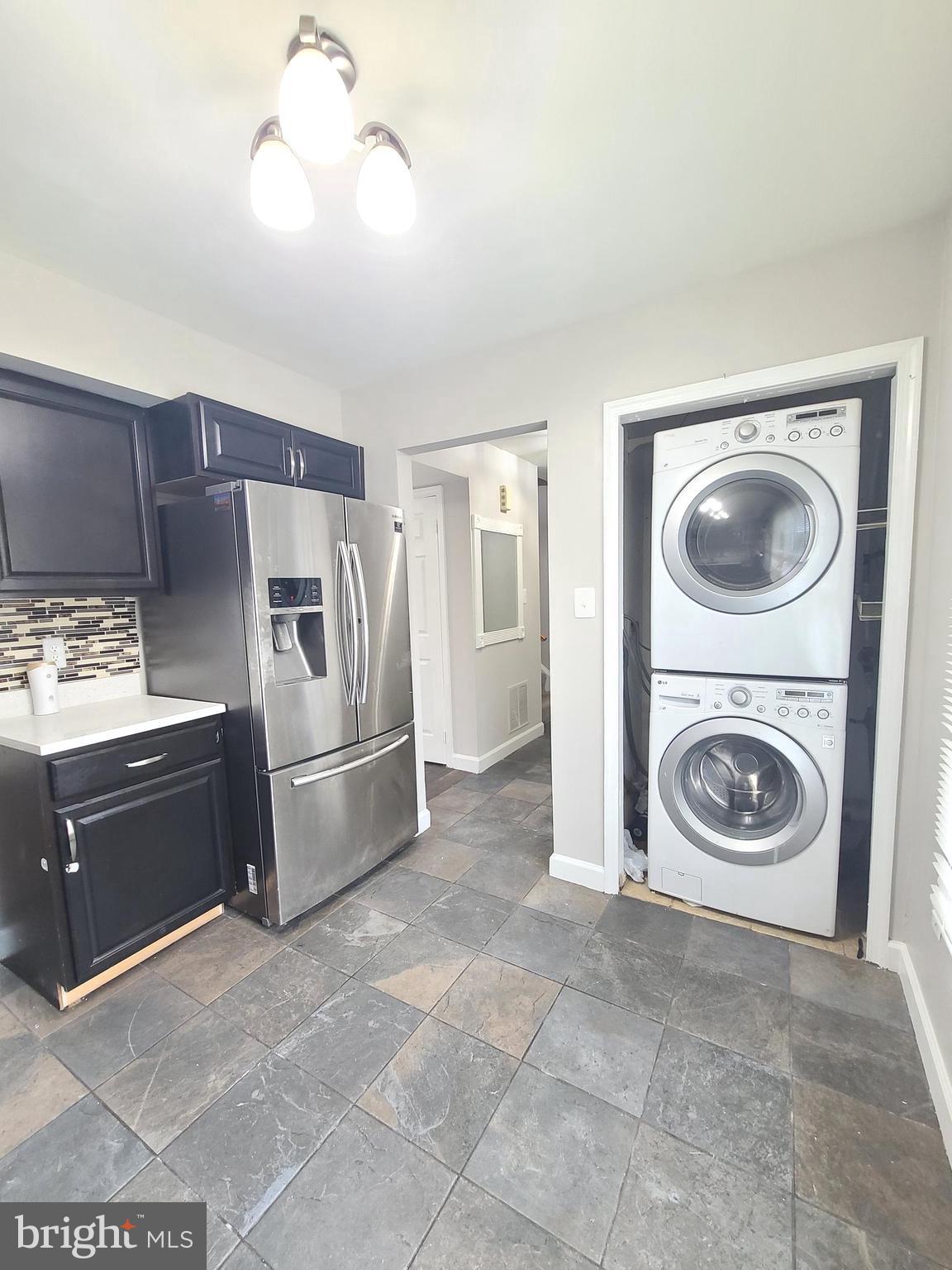 9050 Reynolds Place Manassas, VA 20110 - Photo 7 of 26 a utility room with sink dryer and washer