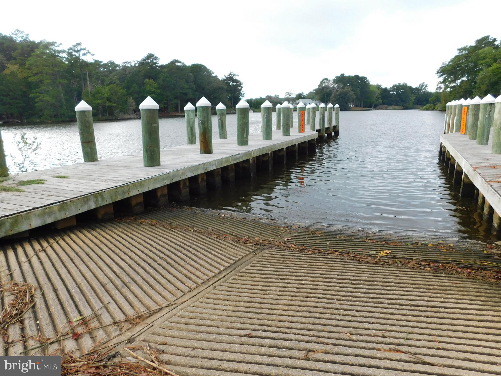 Easterly Portion Lot 1 Easterly Portion Road Bishopville, MD 21813 - Photo 11 of 17 a view of a lake with wooden stairs