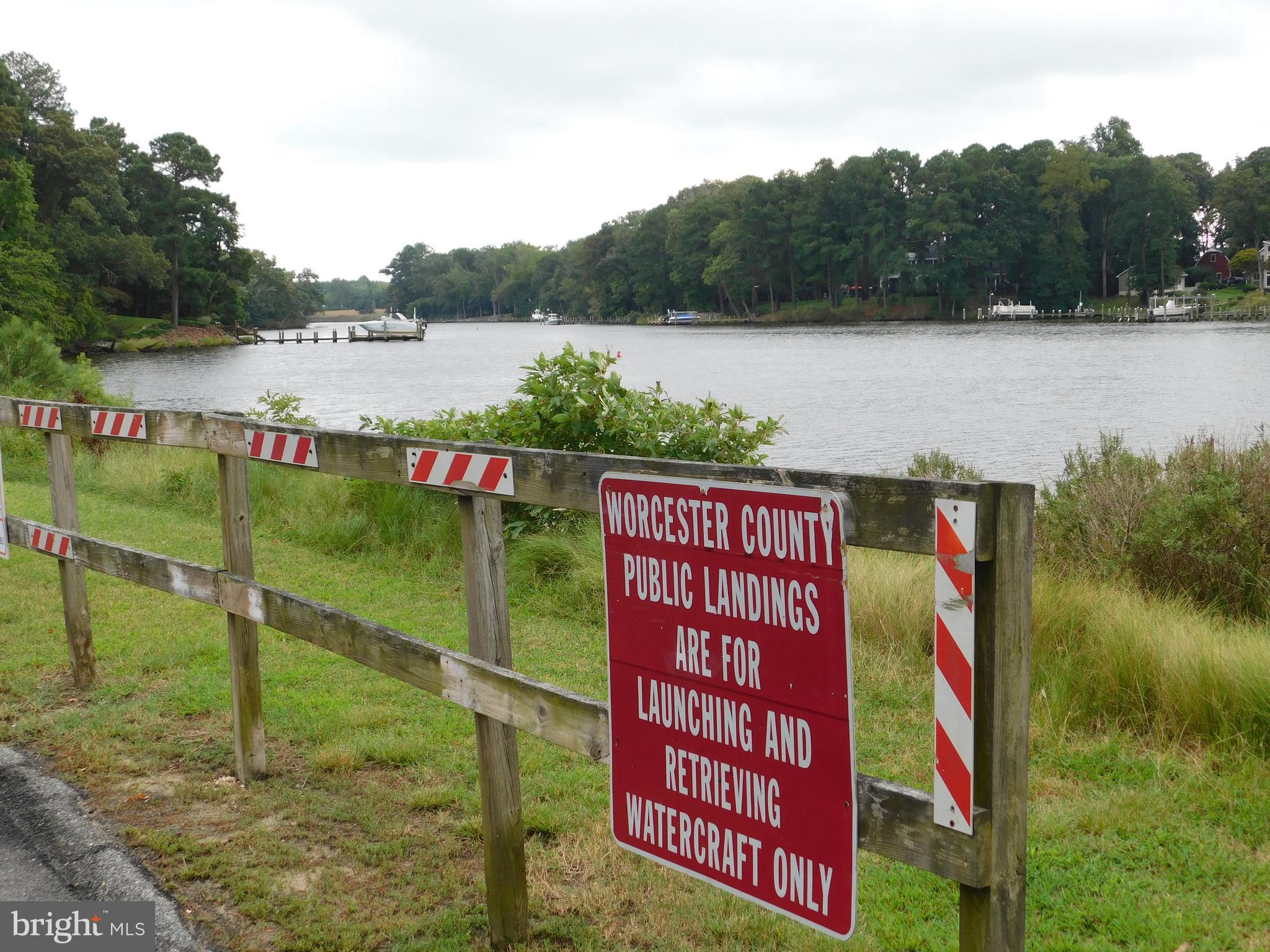 Easterly Portion Lot 1 Easterly Portion Road Bishopville, MD 21813 - Photo 15 of 17 a sign that is sitting on a lake next to a lake