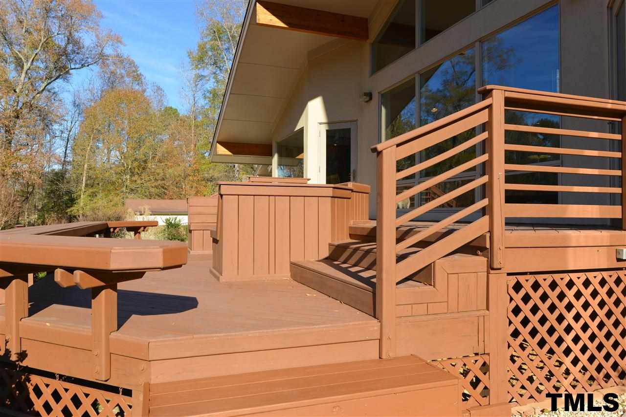 202 Clover Ridge Angier, NC 27501 - Photo 20 of 25 The design of the deck was intentional. Because it’s directly viewed from thefamily room, the deck actually becomes part of the family room. So the clean lines of the home are continued in the design features of the deck.