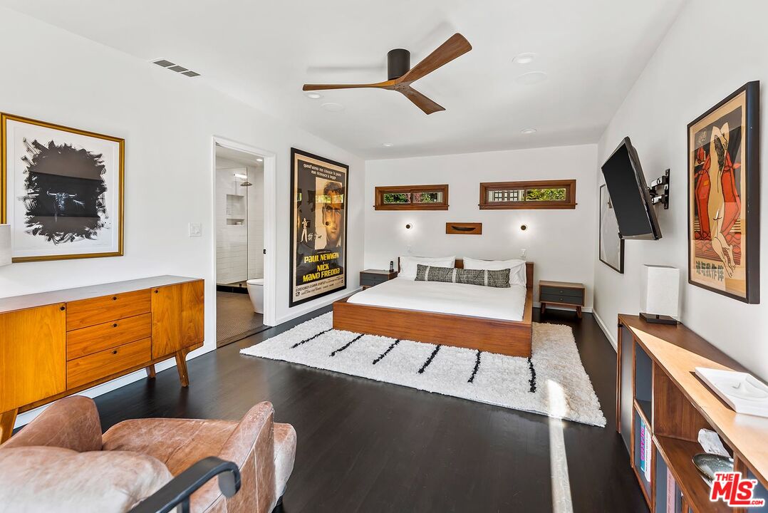 8544 Ridpath Drive West Hollywood, CA 90046 - Photo 16 of 34 a bedroom with furniture and a flat screen tv