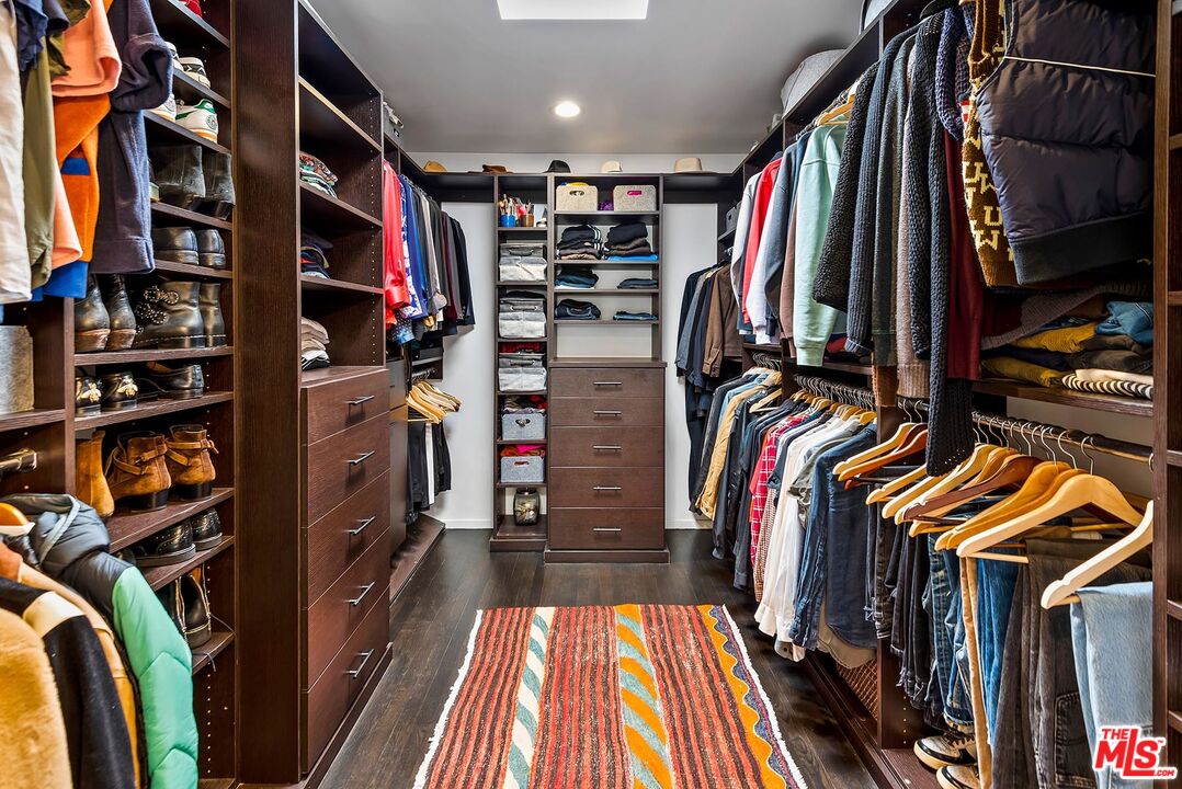 8544 Ridpath Drive West Hollywood, CA 90046 - Photo 19 of 34 a view of walk in closet with clothes and shoes