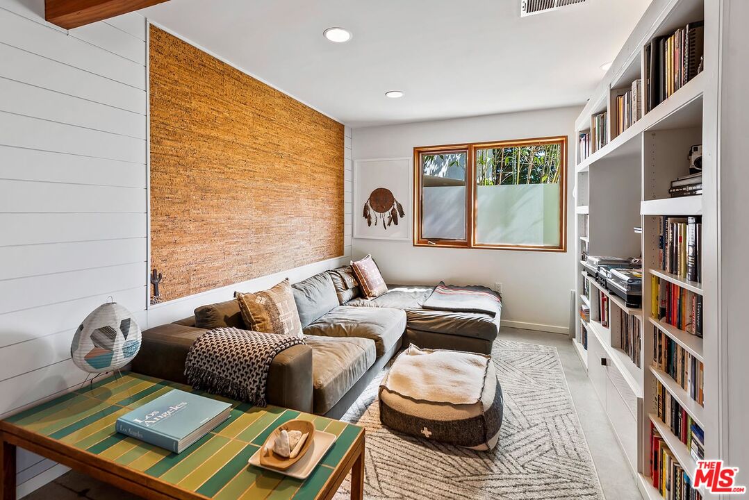 8544 Ridpath Drive West Hollywood, CA 90046 - Photo 22 of 34 a living room with furniture and a window