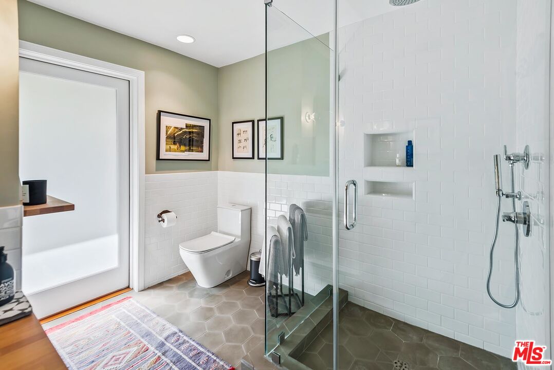 8544 Ridpath Drive West Hollywood, CA 90046 - Photo 26 of 34 a bathroom with a toilet and a shower