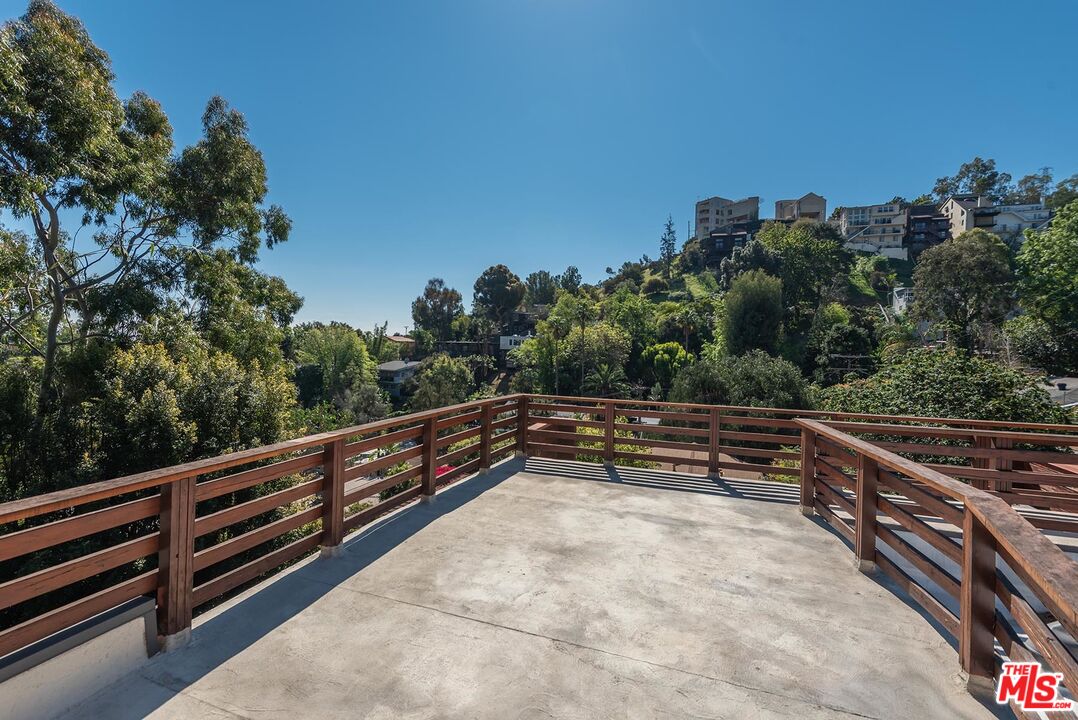 8544 Ridpath Drive West Hollywood, CA 90046 - Photo 31 of 34 a view of outdoor space with wooden deck and seating