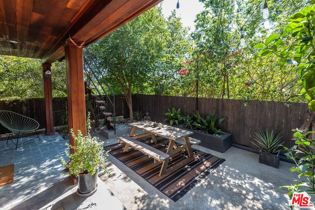 8544 Ridpath Drive West Hollywood, CA 90046 - Photo 33 of 34 a backyard of a house with lots of green space and outdoor seating
