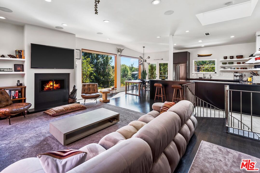 8544 Ridpath Drive West Hollywood, CA 90046 - Photo 5 of 34 a living room with furniture fireplace and flat screen tv