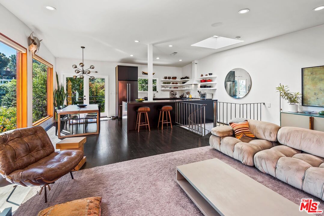 8544 Ridpath Drive West Hollywood, CA 90046 - Photo 7 of 34 a living room with furniture kitchen view and a large window