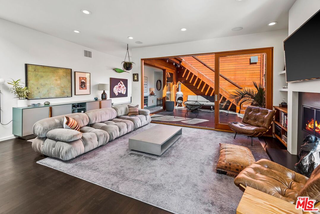 8544 Ridpath Drive West Hollywood, CA 90046 - Photo 8 of 34 a living room with furniture and a flat screen tv