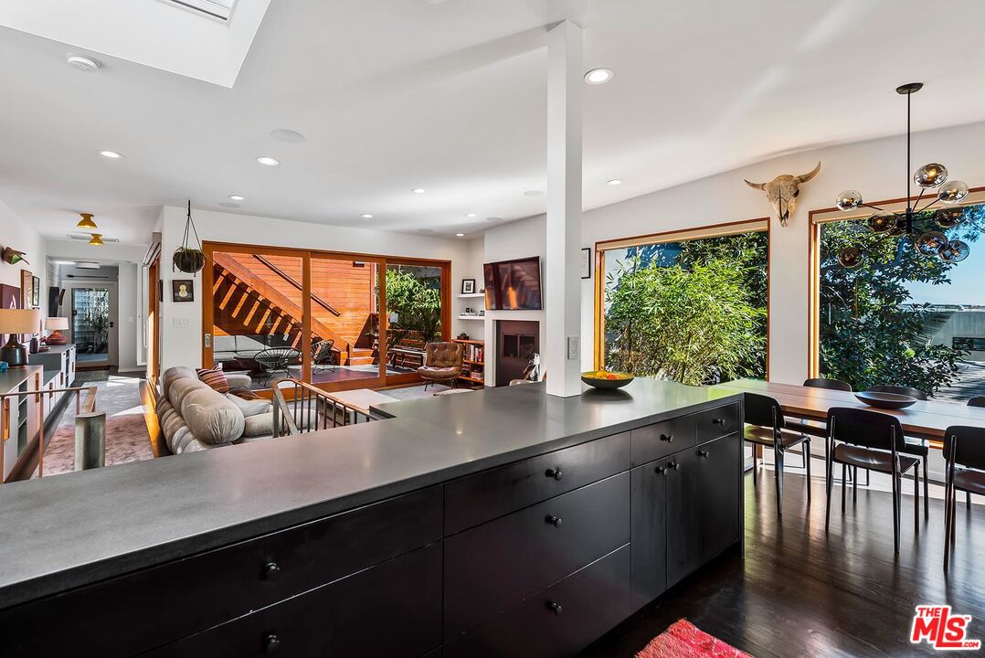 8544 Ridpath Drive West Hollywood, CA 90046 - Photo 10 of 34 a view of a room with kitchen island a large window a sink and cabinets