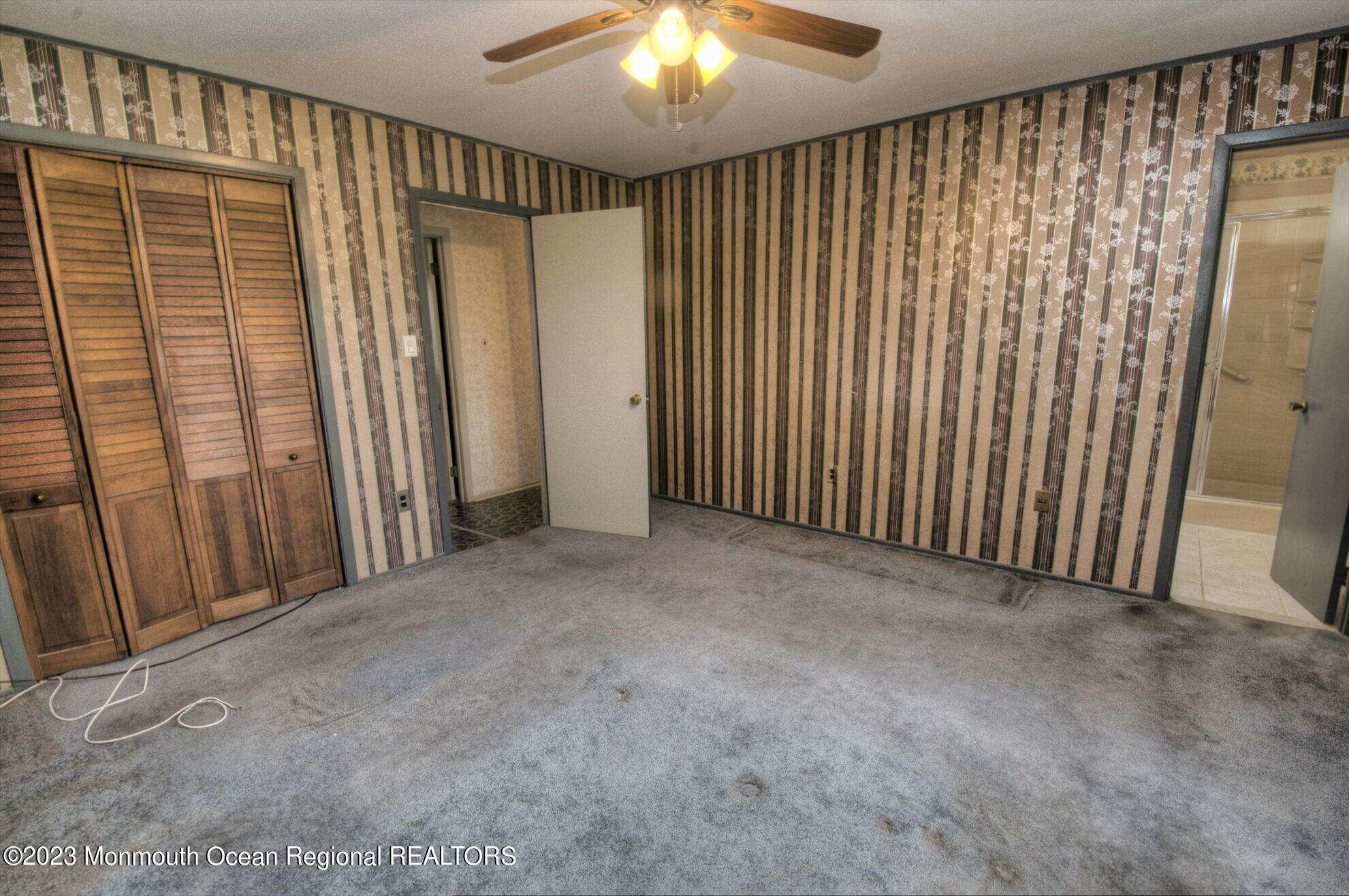 11 Woods Road Freehold, NJ 07728 - Photo 20 of 25 a view of an empty room with wooden floor and a window