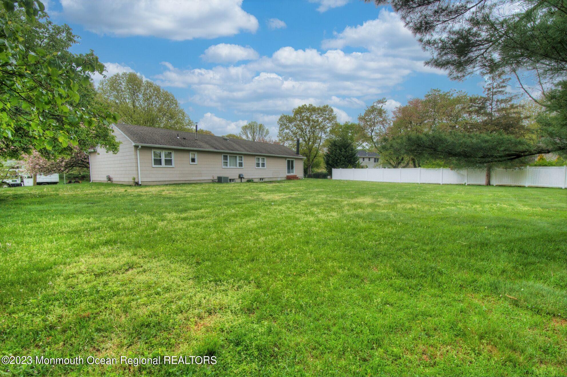 11 Woods Road Freehold, NJ 07728 - Photo 24 of 25 a view of a house with a big yard