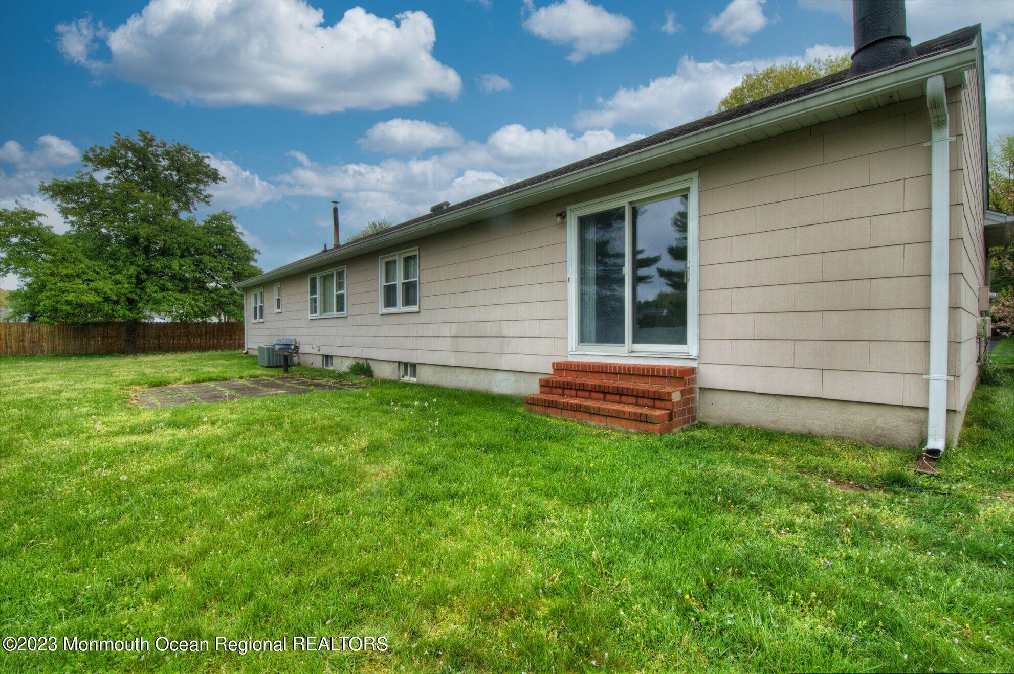 11 Woods Road Freehold, NJ 07728 - Photo 25 of 25 a backyard of a house with lots of green space