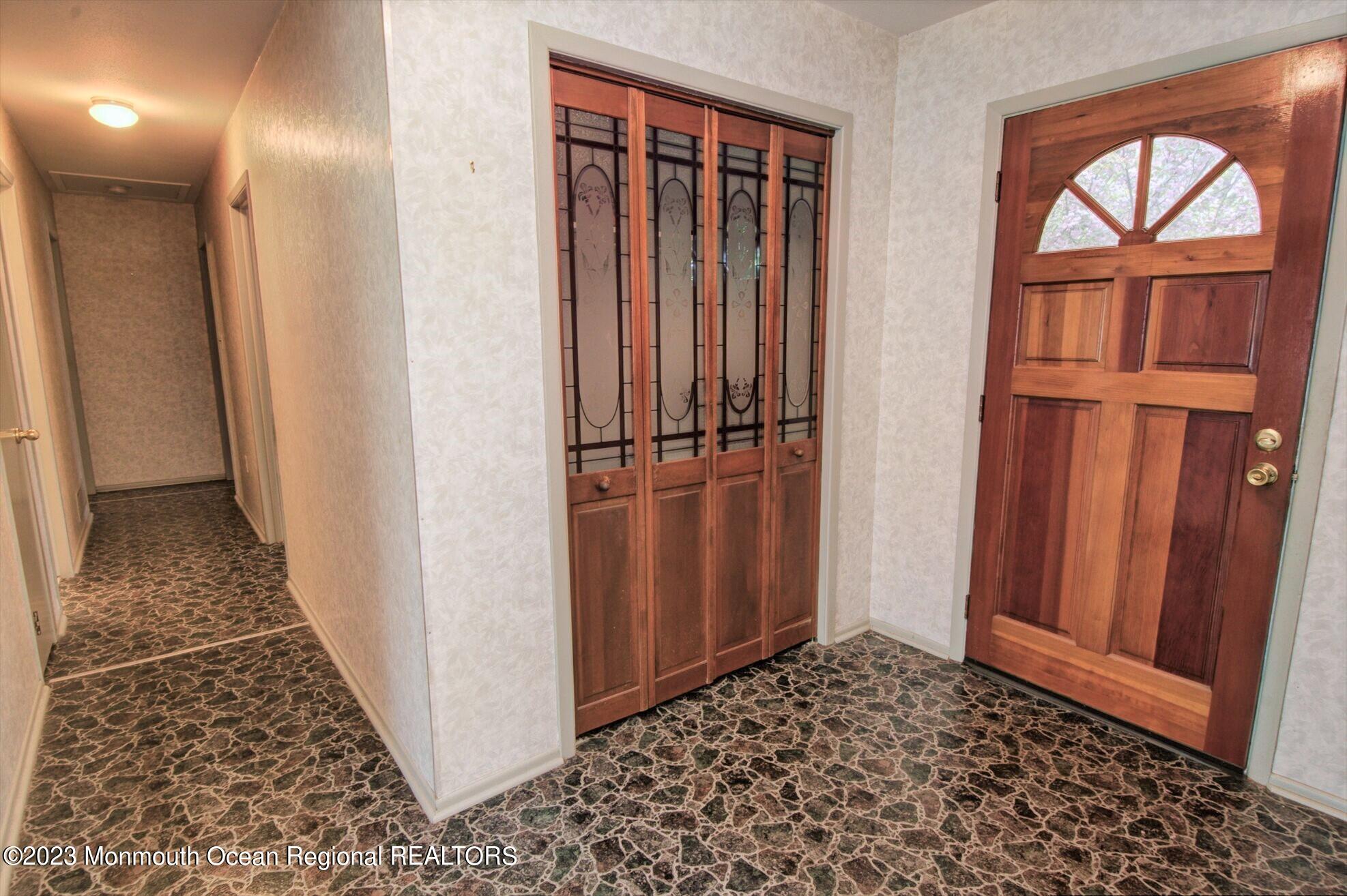 11 Woods Road Freehold, NJ 07728 - Photo 6 of 25 a view of entryway with wooden floor