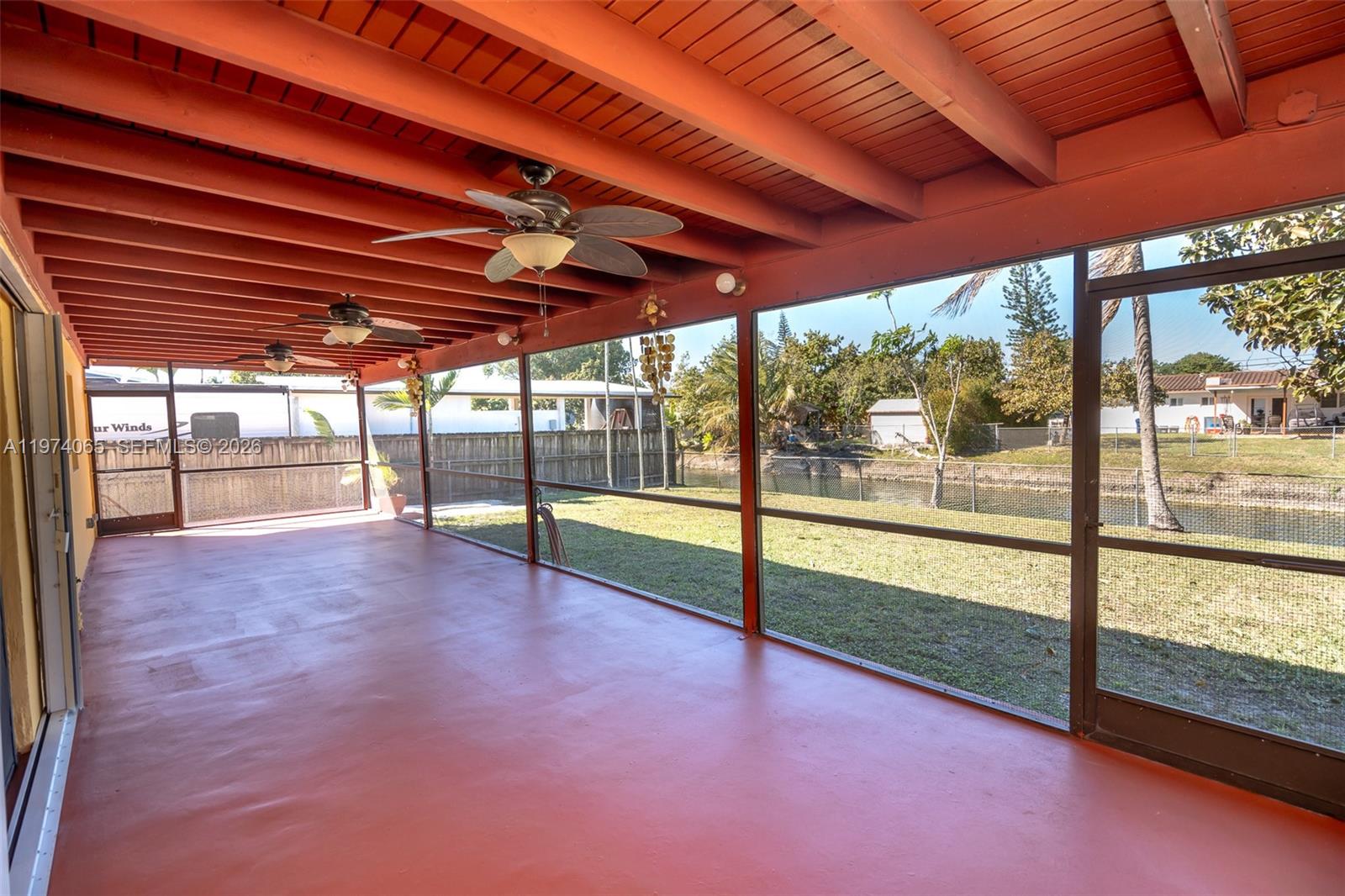 4600 Southwest 104th Avenue Miami, FL 33165 - Photo 11 of 40 a view of an empty room with a sliding door