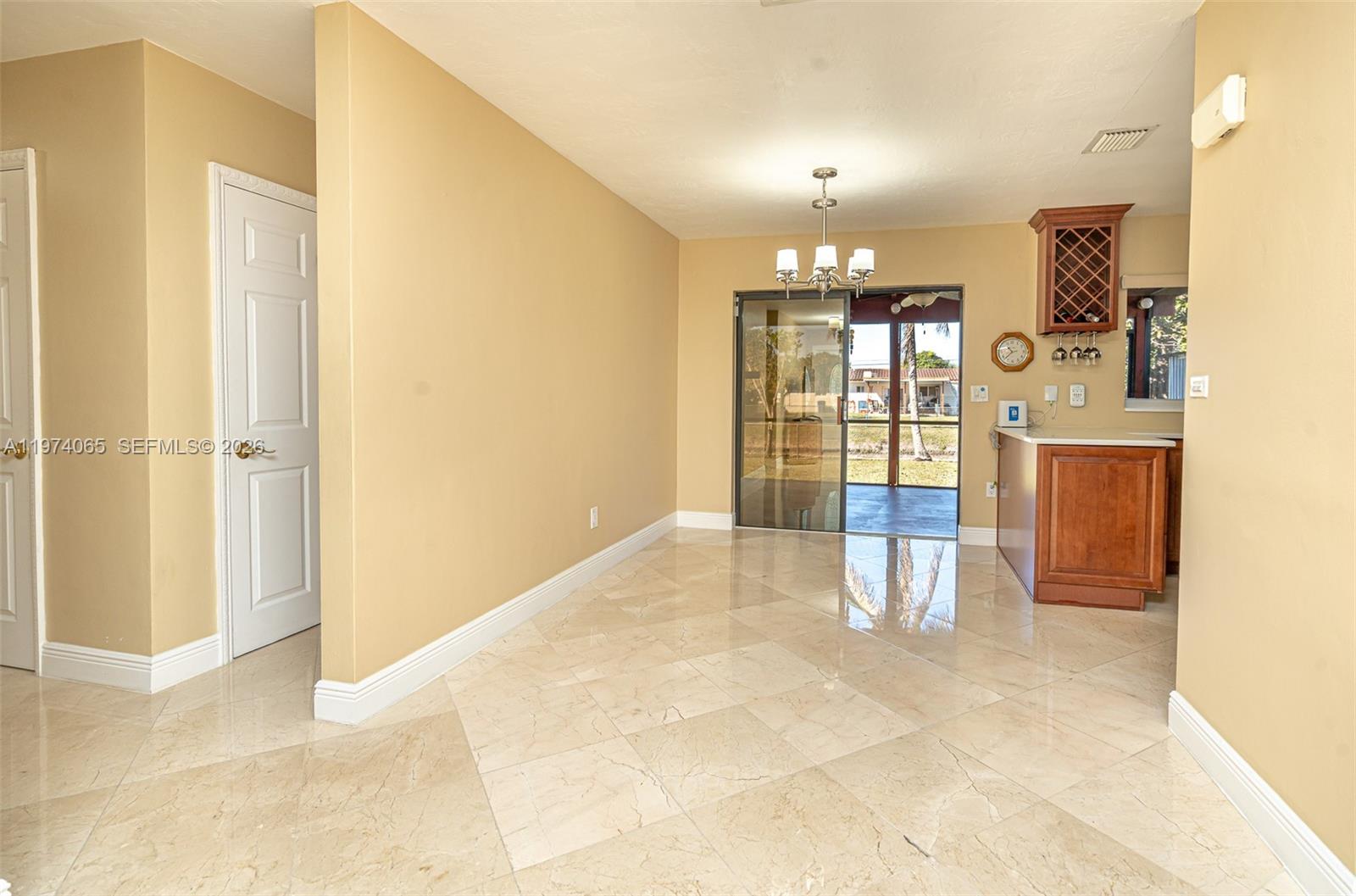 4600 Southwest 104th Avenue Miami, FL 33165 - Photo 22 of 40 a view of an entryway with a chandelier