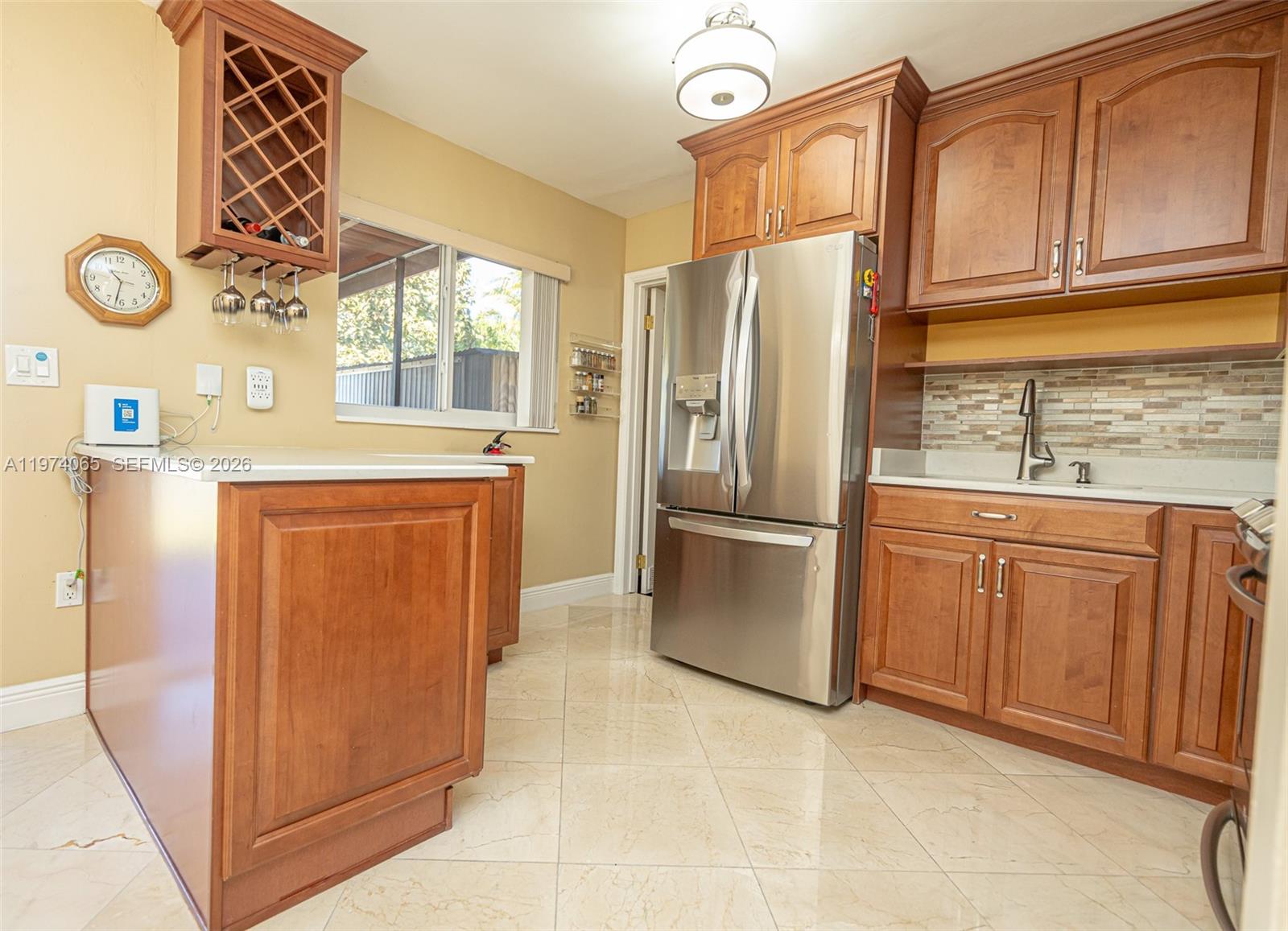 4600 Southwest 104th Avenue Miami, FL 33165 - Photo 24 of 40 a kitchen with stainless steel appliances a refrigerator sink and cabinets