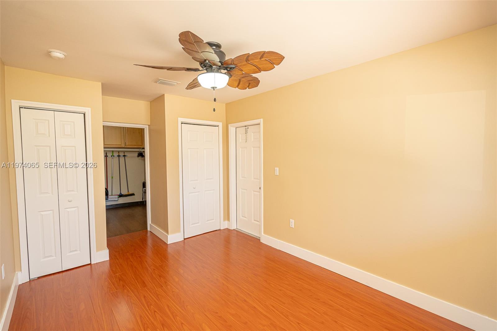 4600 Southwest 104th Avenue Miami, FL 33165 - Photo 32 of 40 a view of empty room with wooden floor and fan