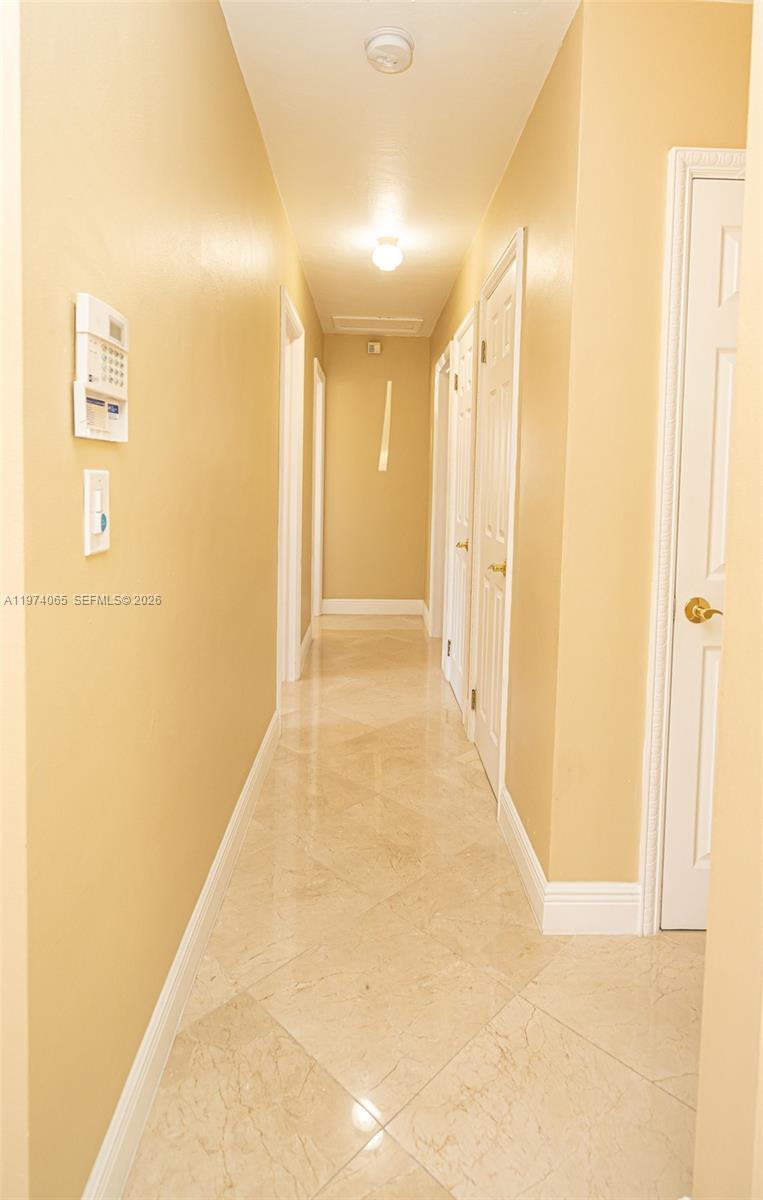4600 Southwest 104th Avenue Miami, FL 33165 - Photo 34 of 40 a view of a hallway with wooden floor