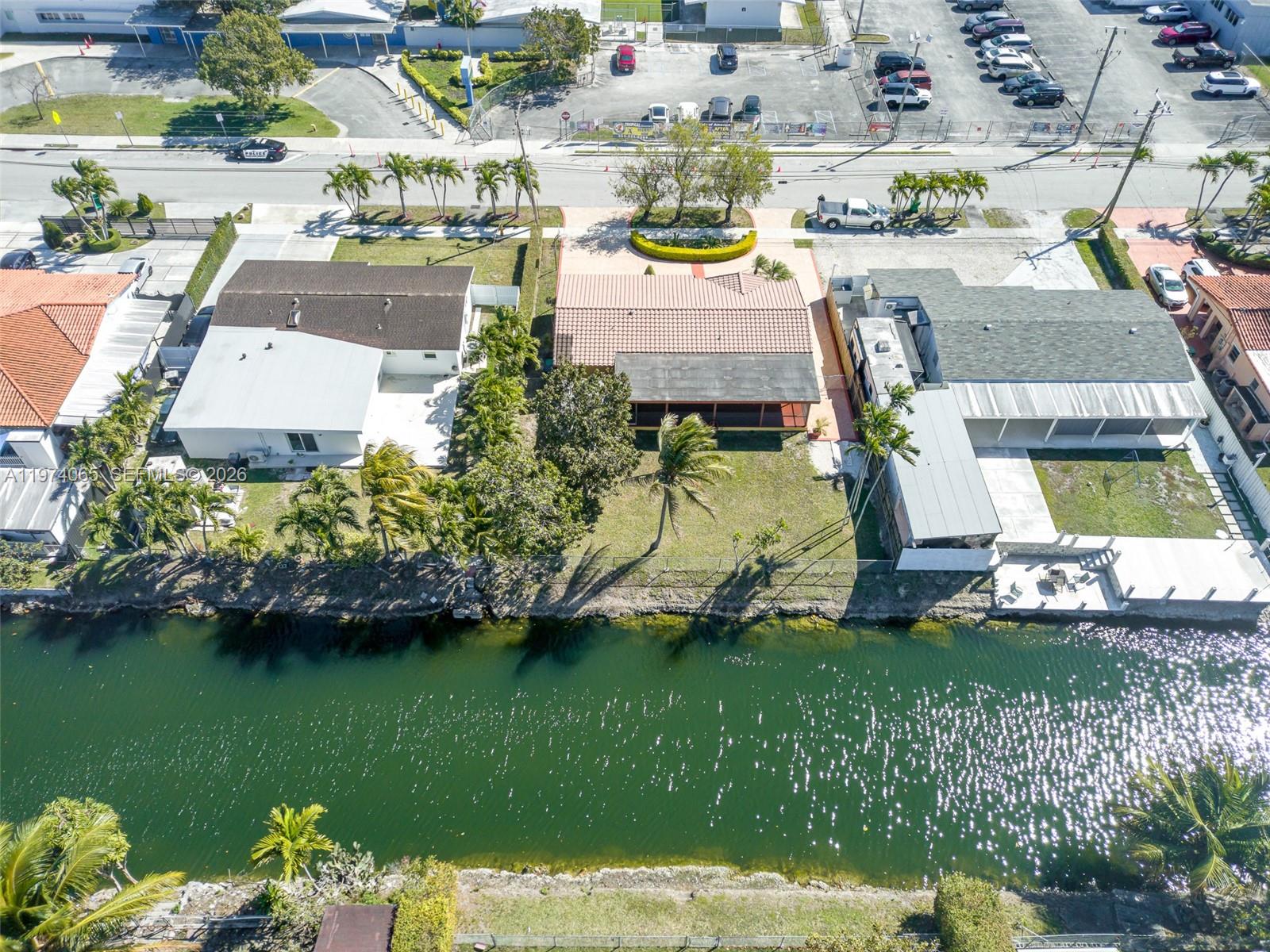 4600 Southwest 104th Avenue Miami, FL 33165 - Photo 39 of 40 an aerial view of a house with a garden and lake view