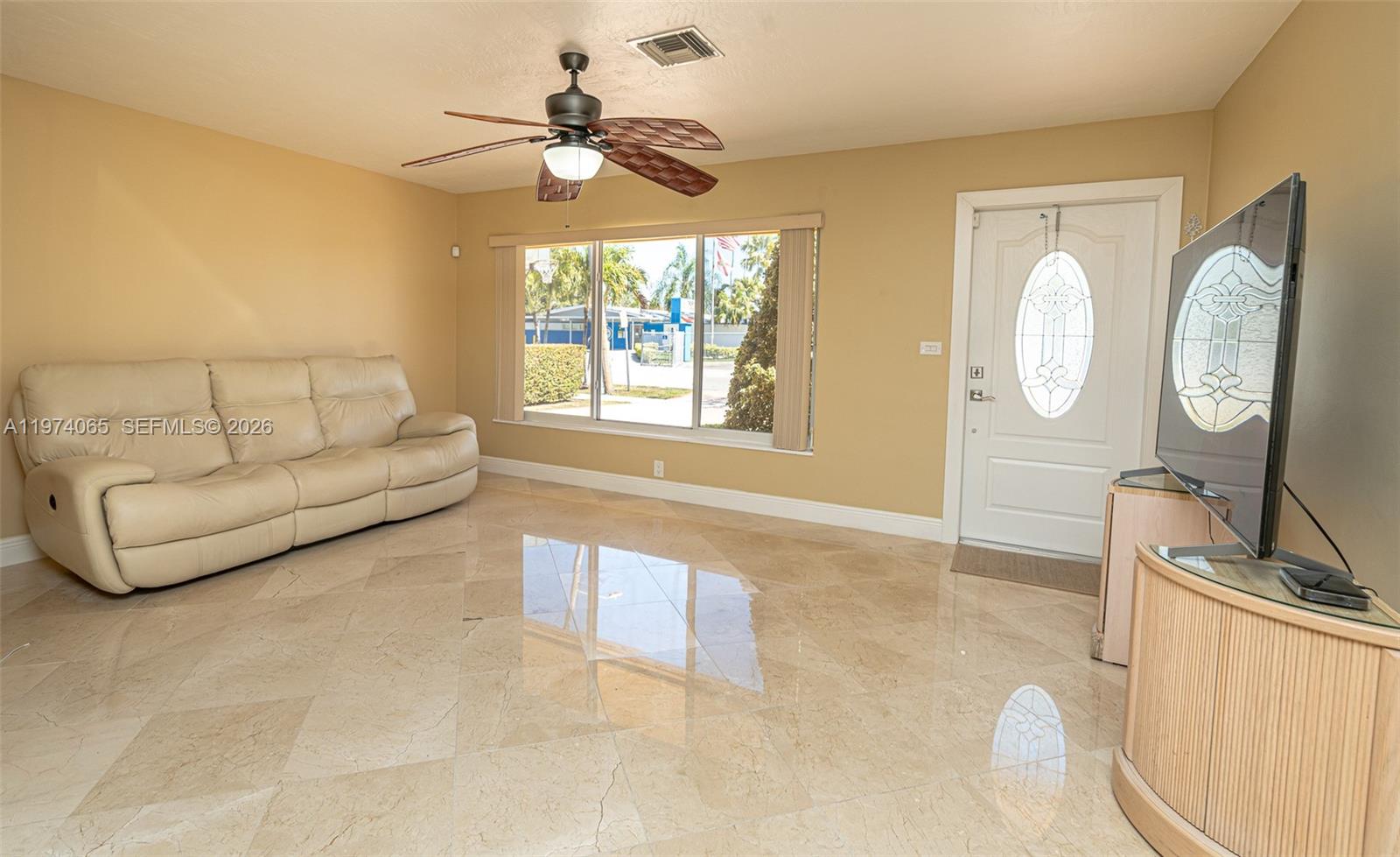4600 Southwest 104th Avenue Miami, FL 33165 - Photo 5 of 40 a living room with furniture a chandelier and a window