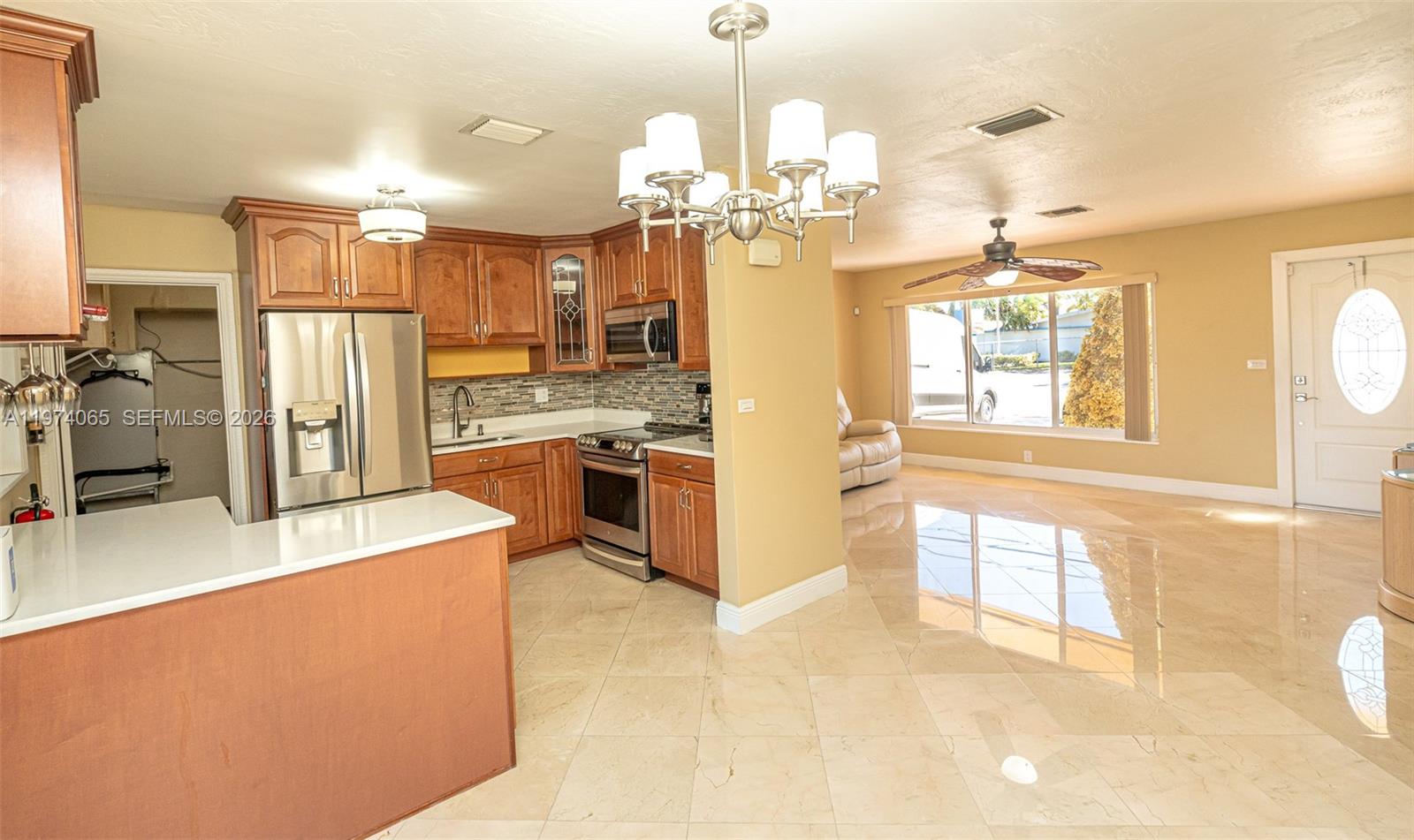 4600 Southwest 104th Avenue Miami, FL 33165 - Photo 6 of 40 a view of a kitchen center island and stainless steel appliances