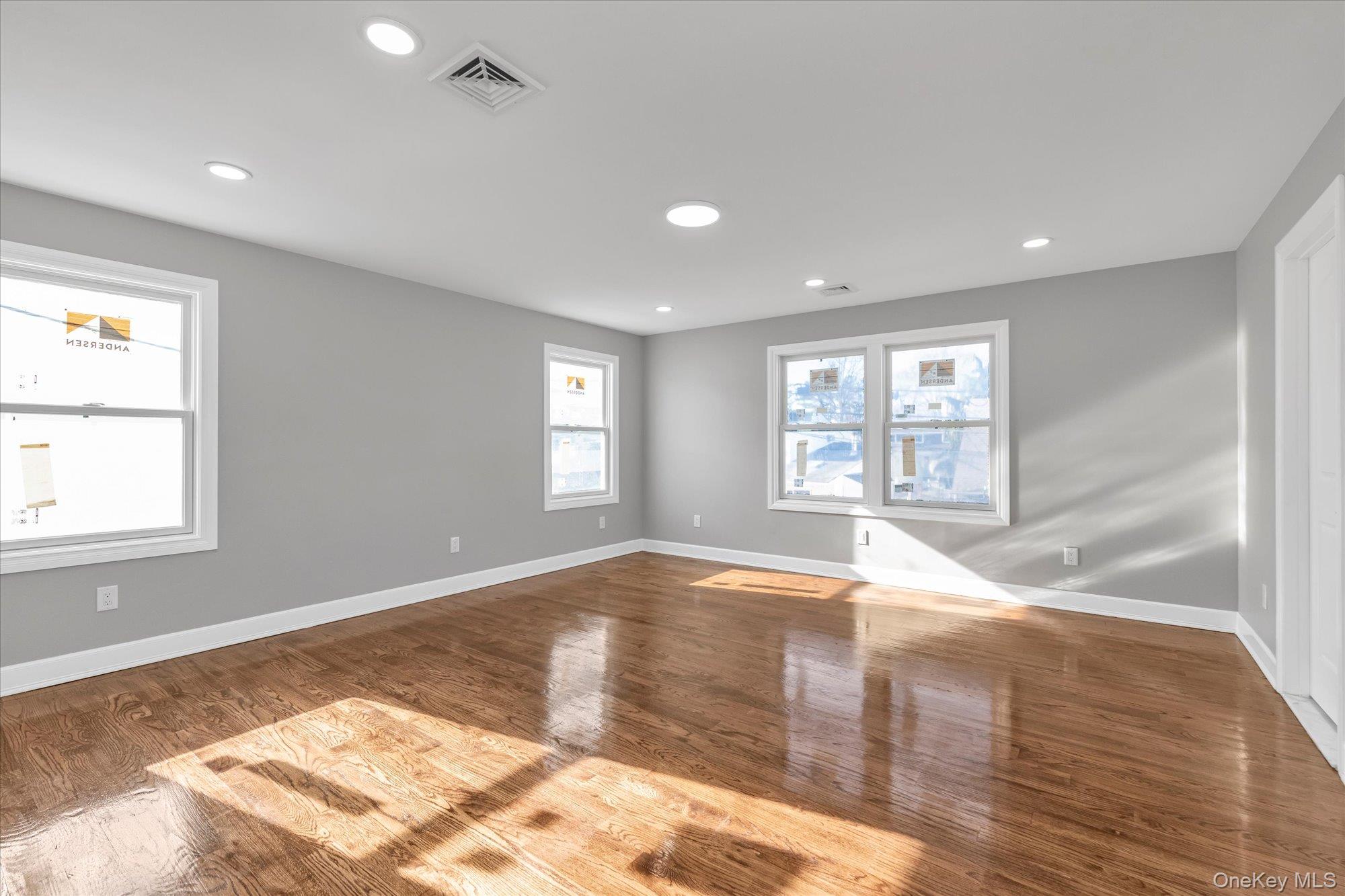 33 Prentice Road Levittown, NY 11756 - Photo 15 of 24 a view of empty room with wooden floor and fan
