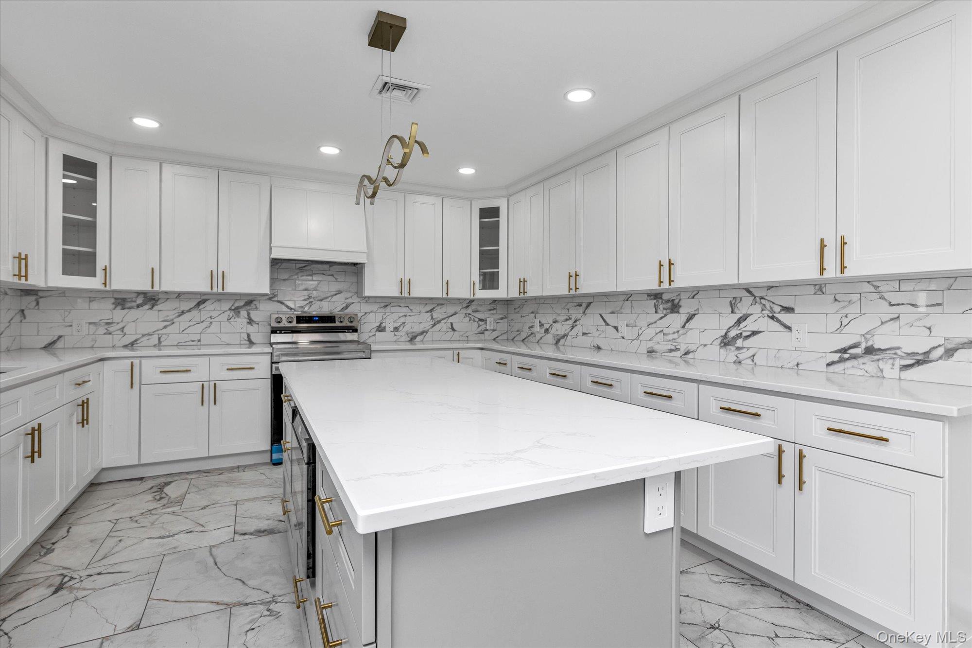 33 Prentice Road Levittown, NY 11756 - Photo 10 of 24 a kitchen with a sink window and cabinets