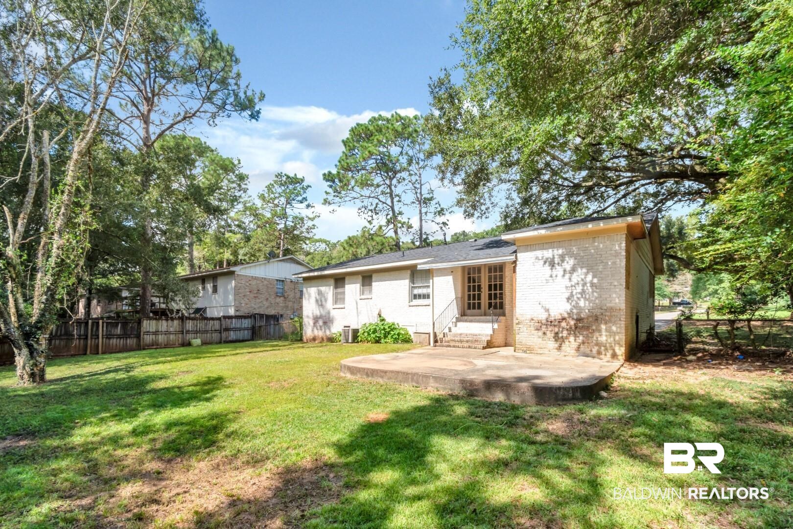 320 Vanderbilt Drive Mobile, AL 36608 - Photo 33 of 39 Rear view of property with a yard and a patio area