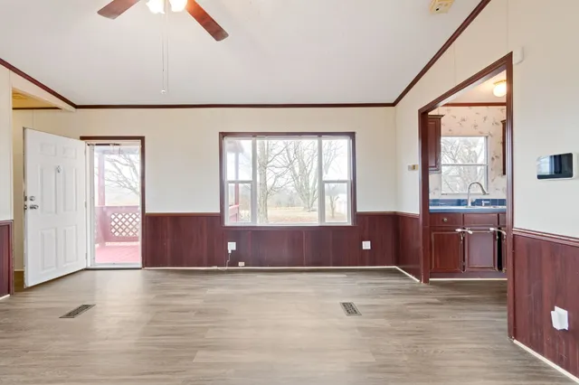 a view of room with window and a dresser