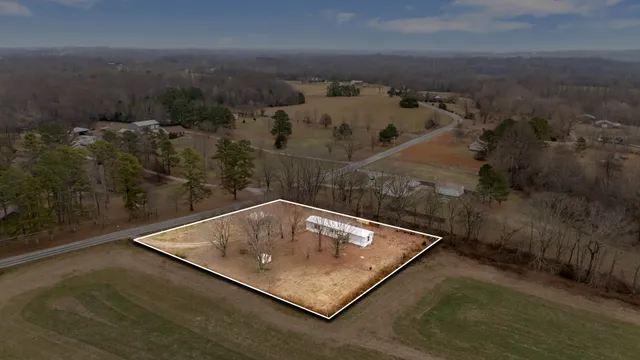 an aerial view of house with roof deck