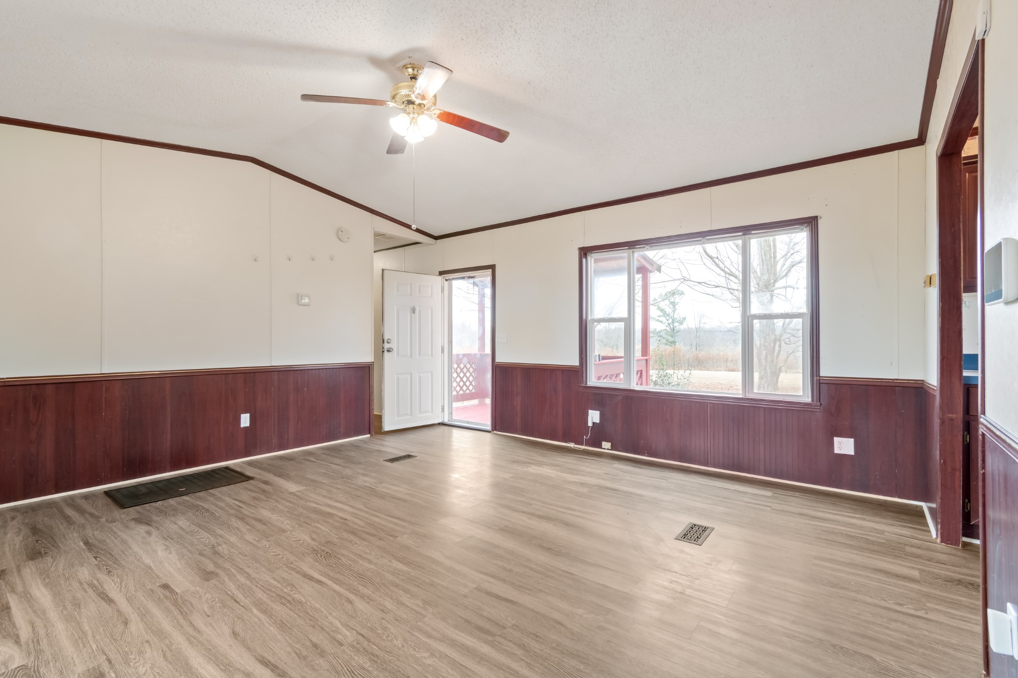640 Powell Chapel Road Pulaski, TN 38478 - Photo 5 of 50 wooden floor in an empty room with a window