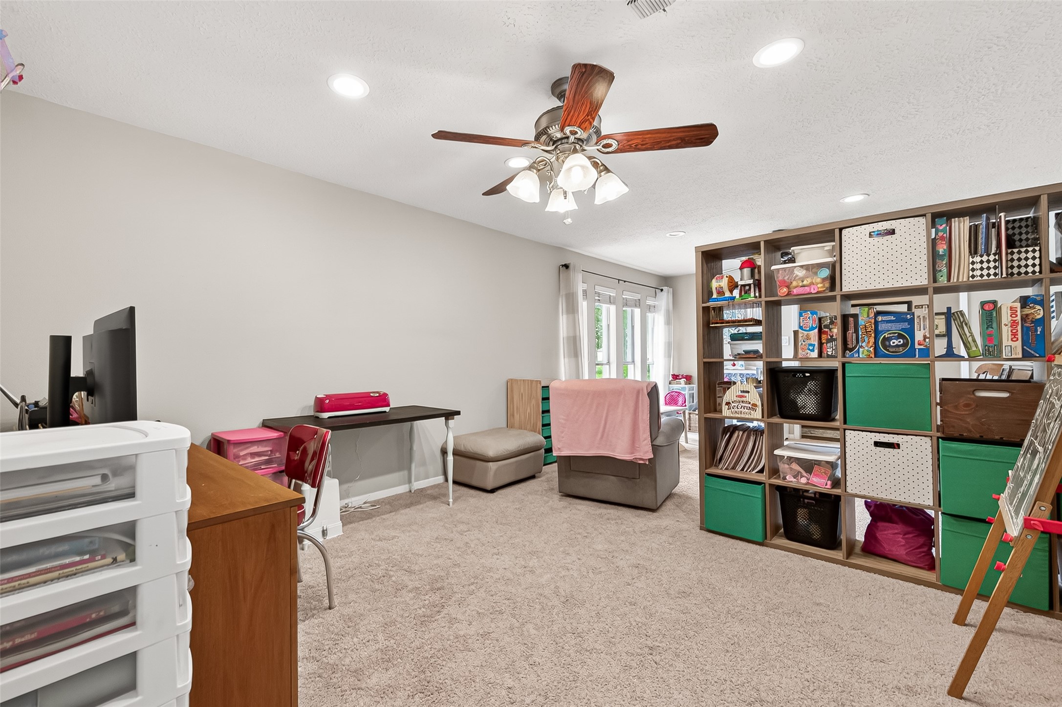 17611 Sorrell Ridge Drive Spring, TX 77388 - Photo 11 of 50 a bedroom with furniture and a book shelf