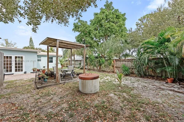 a view of a patio with chair and tables