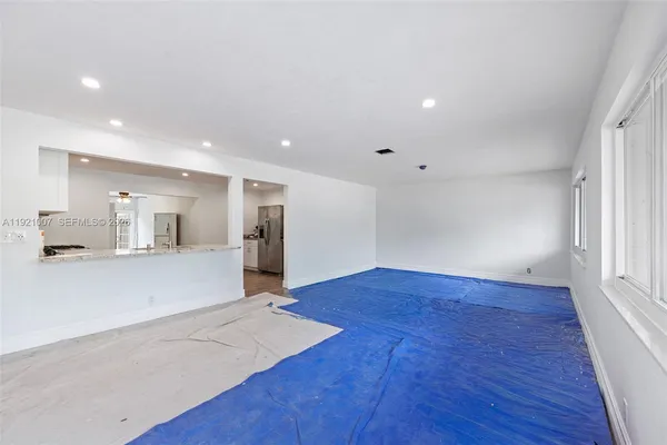 a view of kitchen with cabinets and wooden floor
