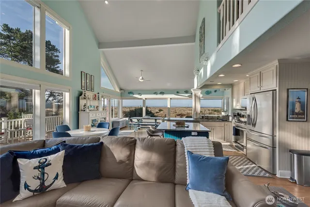 a bathroom with a granite countertop sink a toilet and shower curtain