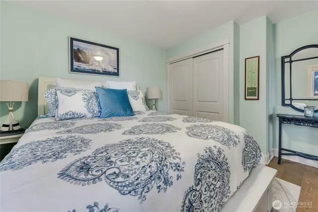 a living room with furniture a fireplace and a kitchen counter space