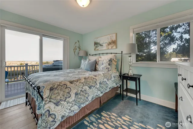 a spacious bathroom with a granite countertop sink and a mirror