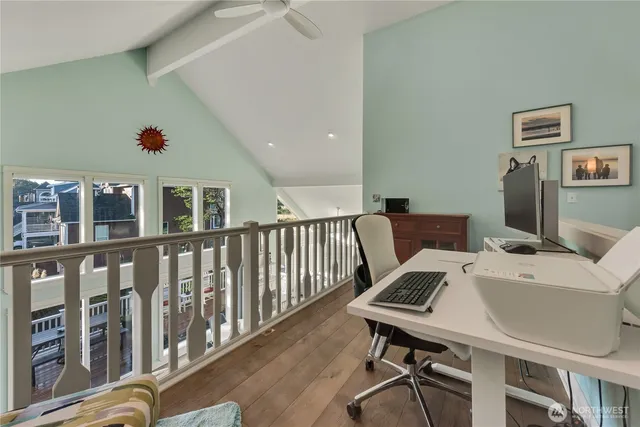 a bathroom with a sink a mirror and a potted plant