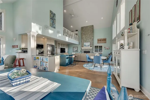 a living room with lots of furniture and kitchen view