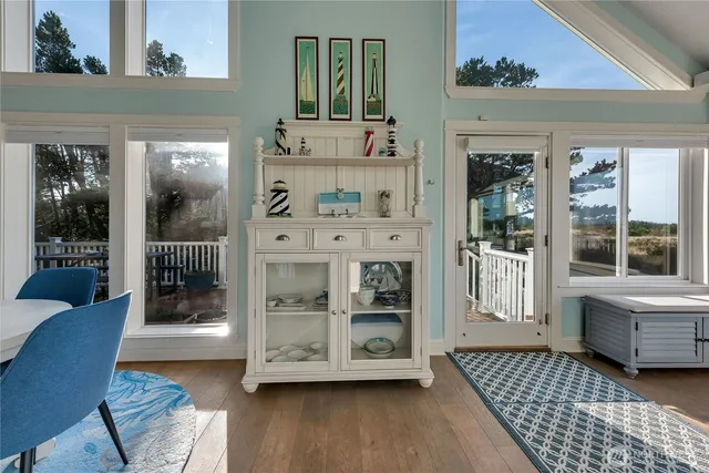 a kitchen with counter space appliances and a view of living room