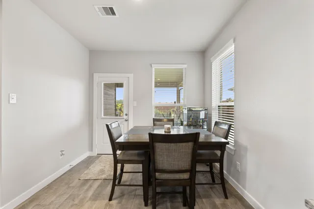 a bedroom with a bed lamp and a window