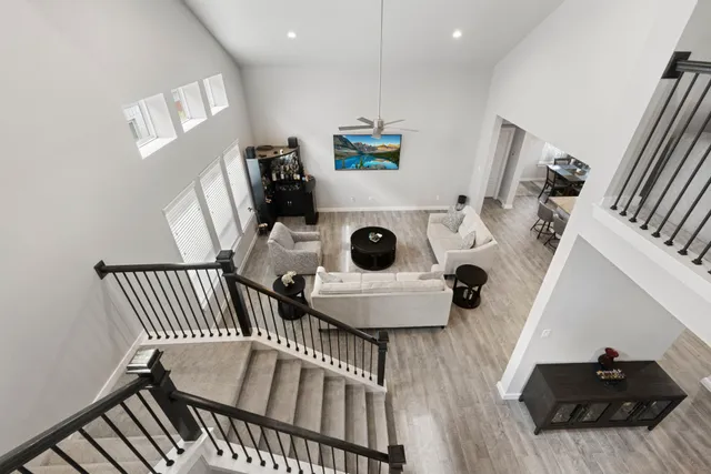 a living room with lots of books and a book shelf