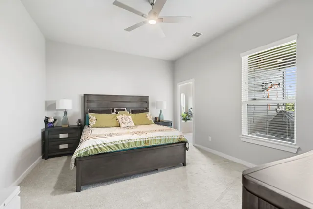 a bathroom with a sink vanity mirror and toilet