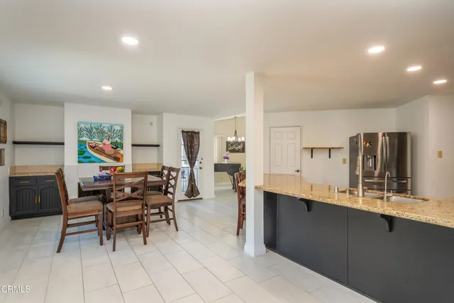 a view of a kitchen and dining room