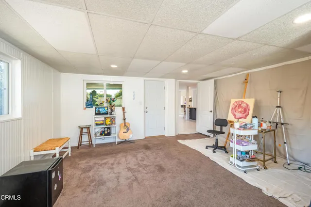 a living room with furniture and a table