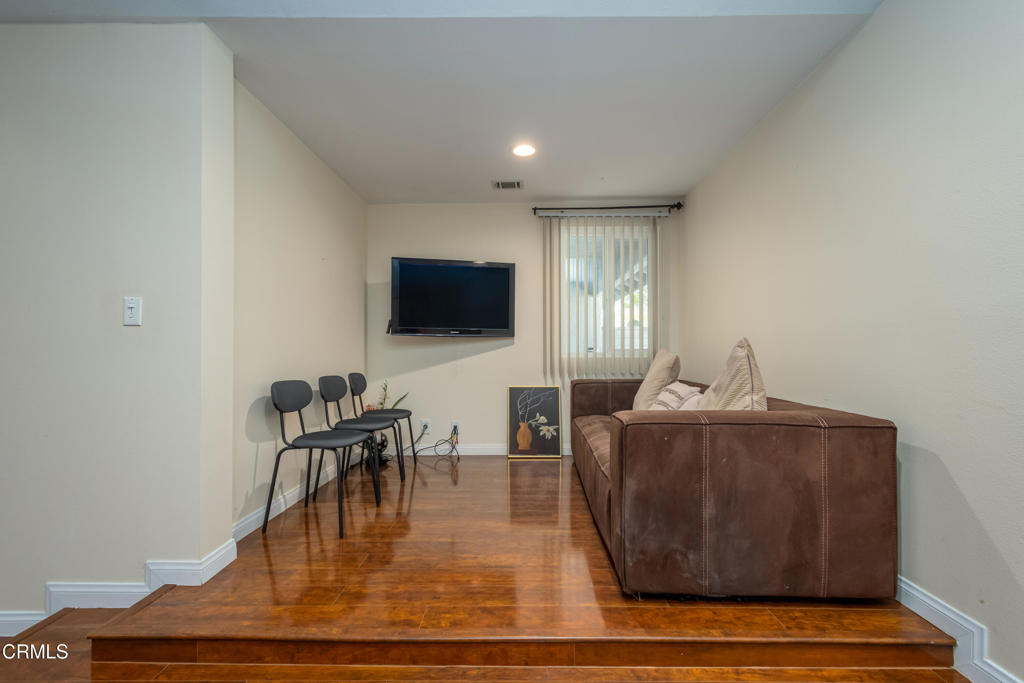 670 Joliet Place Oxnard, CA 93030 - Photo 16 of 33 a living room with furniture a flat screen tv and a fireplace